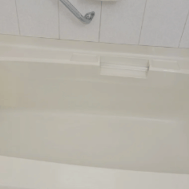Clean spotless bathtub in a residential bathroom